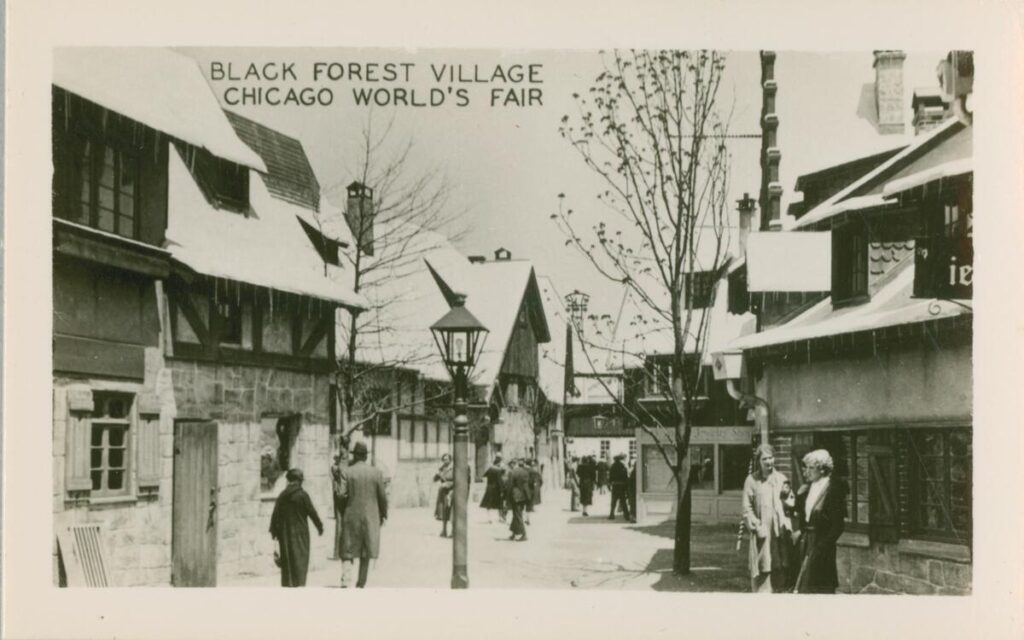 Photo of snow covered rooftops and people walking on the street.