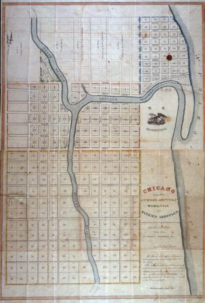 Colored printed early map of Chicago showing the city split into many rectangular plots. The run between the lakeshore and the Chicago River and to the west of both branches of the river.