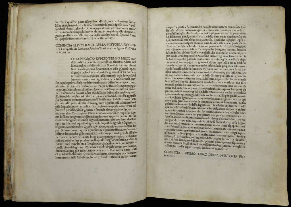 Two-page spread from an early printed book. The text is cented in each page with wide margins on the three on-spine sides.