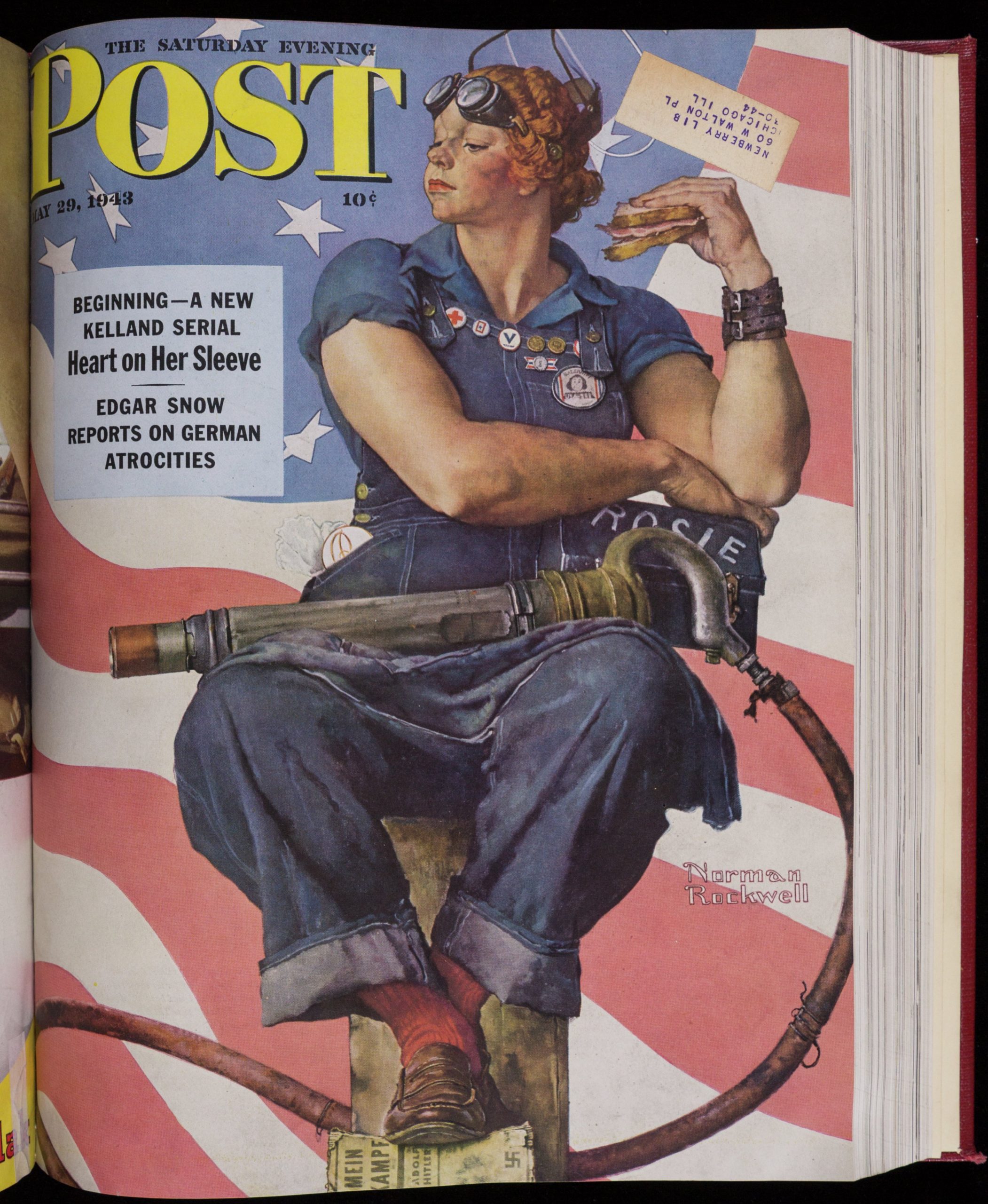 Painting of a white woman wearing blue work overalls and goggles on her forehead. She sits on a box while eating a sandwich. A riveter tool lays across her lap, and her feet rest on a copy of Mein Kampf. The background is in American flag.