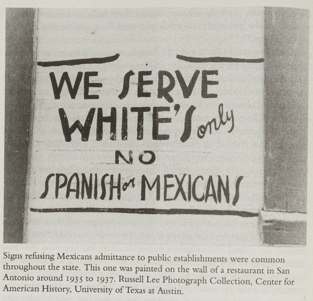 Black-and-white sign on a wall reading "We Serve White's Only; No Spanish or Mexicans." Originally from the Russell Lee Photograph Collection, Center for American History, University of Texas at Austin.