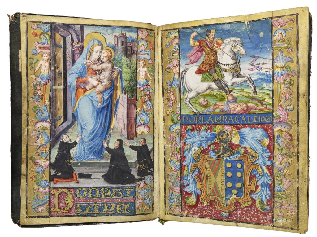 Two-page spread of full-page illuminations. On the left is the Virgin Mary holding the infant Christ and standing on a patio between a building and a garden. Both are white. Three smaller white figures kneel at her feet, praying. The scene is surrounded by a border of flowers. The right-hand page is split into an upper and lower image. The upper image depicts St. James, a white man wearing armor and riding a horse, spearing a wounded light-skinned man laying on the ground. Below is a richly decorated coats of arms. These are also surrounded by a floral border.