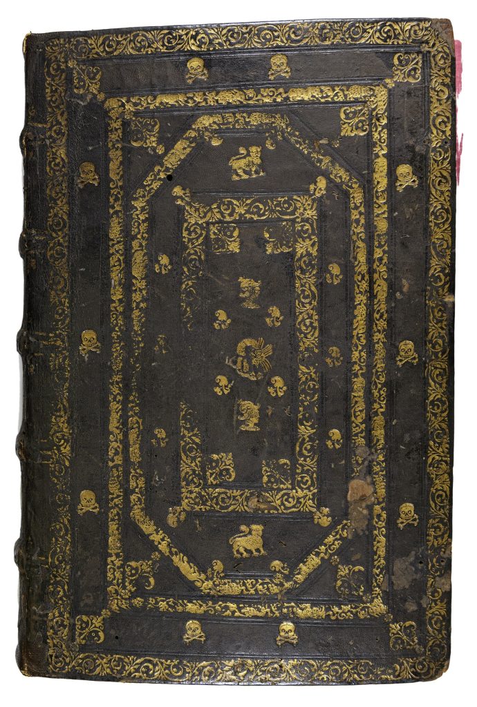 Front cover of a manuscript book covered in brown leather and stamped with gold designs. Lines of floral patterns make rectangles across the cover with skulls and crossbones, griffins, and knight helmets between the rectangles.