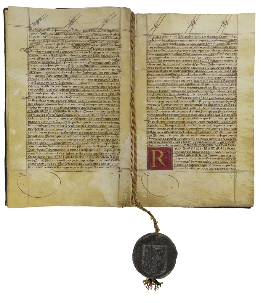 Two-page spread of a manuscript book. Both pages are filled with handwritten text. A multi-colored twisted cord runs down the spine of the book and out the bottom, where it is embedded in a black seal imprinted with a coat of arms.