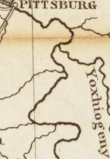 Cropped image of a map showing a dark curling line representing a river and lighter lines representing tributaries.