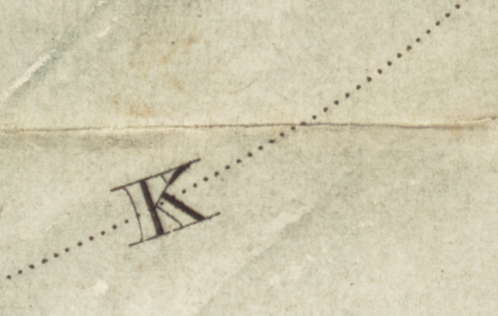 Detail of a map showing the letter "K" on top of a dotted line.