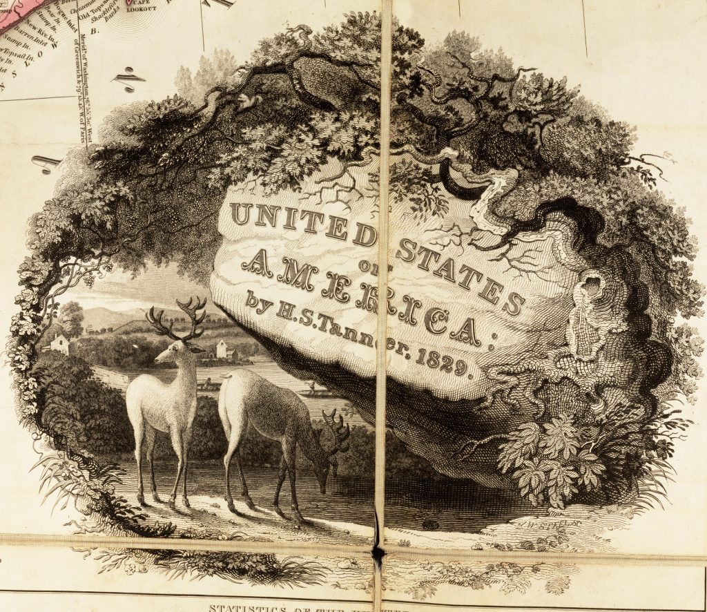 Detail of a map showing its title, "United States of America: by H.S. Tanner, 1829," inside a decorative cartouche. The cartouche shows two deer grazing on a riverbank across from a few houses and is framed a curving tree and flowers.