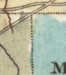 Detail of a map showing the intersection of three counties in a T shape. The upper one is colored yellow, the lower left one green, and the lower right one blue. They are separated by dotted lines.