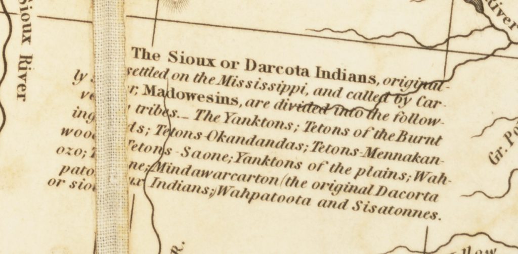 Detail of a map showing a paragraph of text listing the bands of the Dakota people.