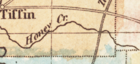 Detail of a map showing a dark squiggly line representing a river. The line is marked "Honey Cr. [Creek]."