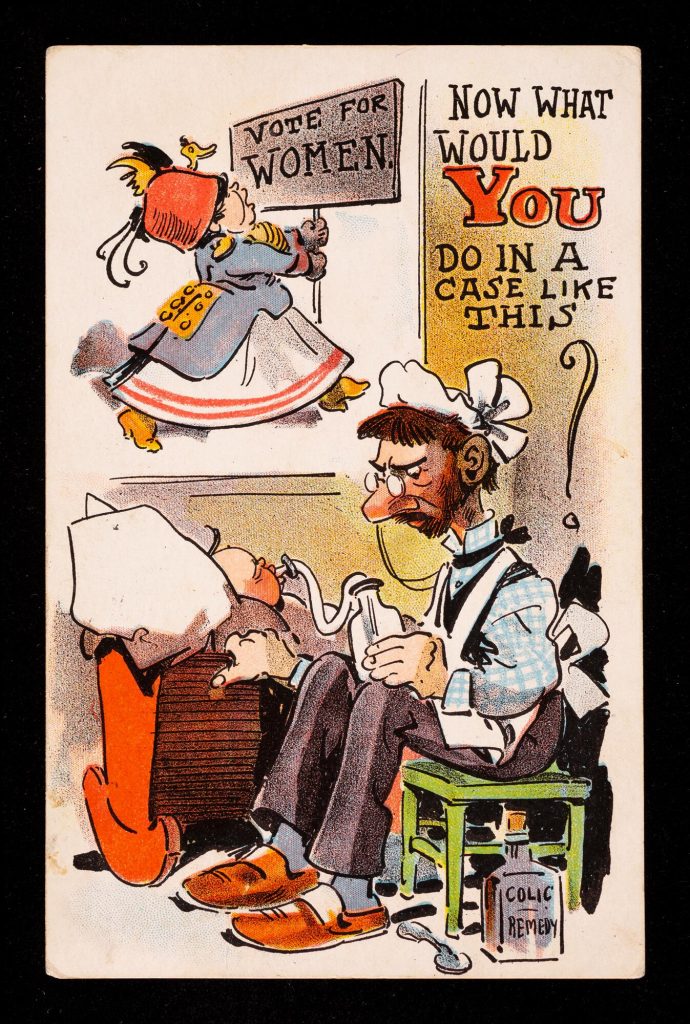 Anti-women's-suffrage postcard showing an angry white man nursing a baby while a white woman, implied to be his wife, is protesting for women's votes outside.
