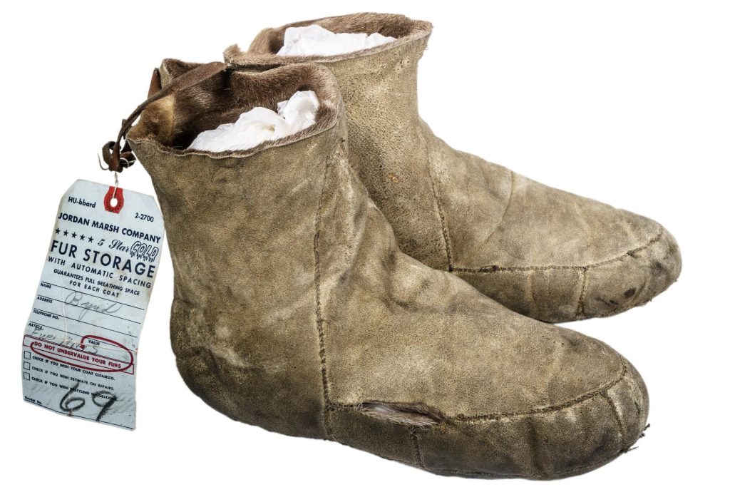 Pair of reindeer skin mukluks with fur storage tag.