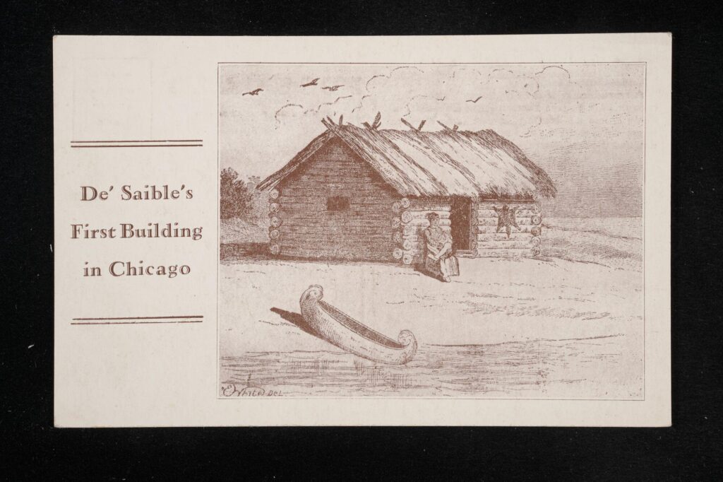 Line drawing of a person sitting outside of a log cabin next to a river. There is a canoe drawn up on the beach.