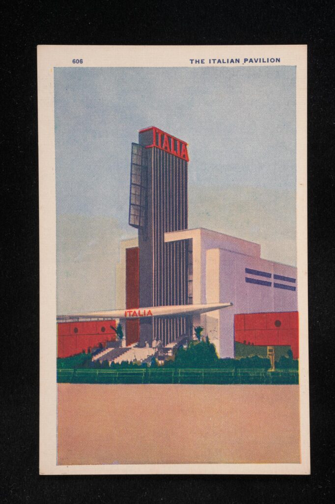 Large white and red building with a blue and red pylon in the middle of the building labeled "Italia"
