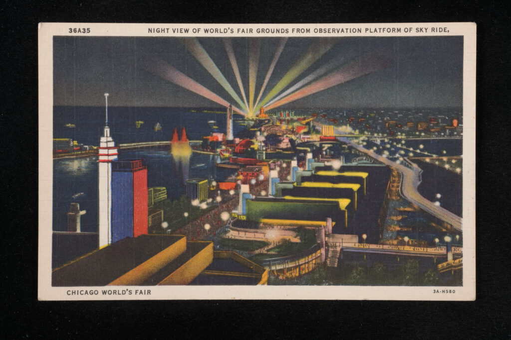 Postcard with aerial view of a city with multicolored lights shining in the sky and on the buildings.