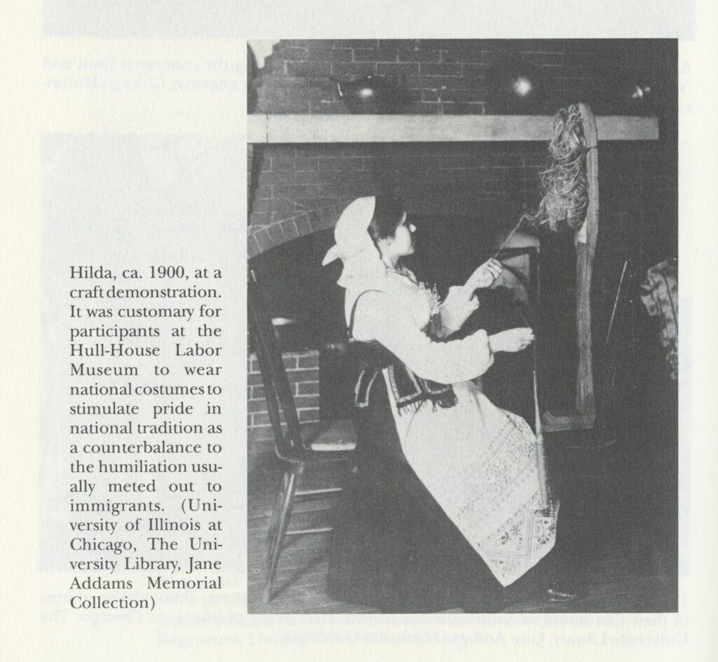 Black-and-white photo of Hilda Satt Polacheck using a drop spindle. She is a young white woman wearing a traditional Polish outfit.