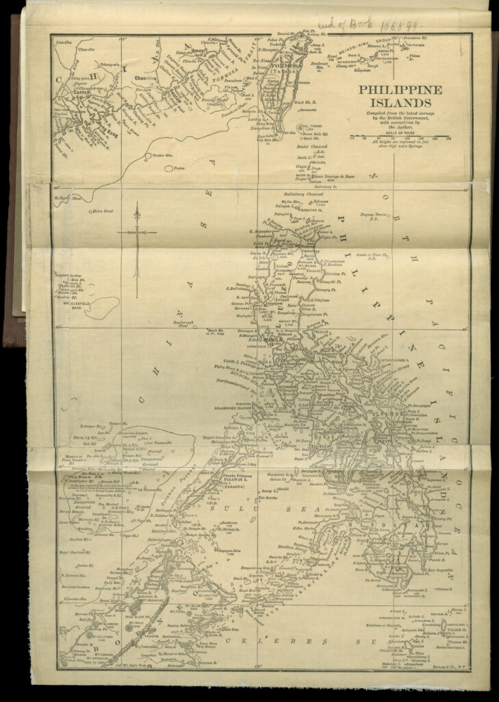 Black-and-white map of the Philippines folded out from a printed book.